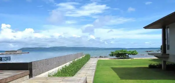 view of the infinity pool with the sea behind it